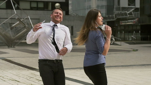 Businesspeople dancing on the square, slow motion shot,steadycam