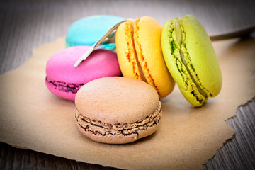 Sweet Tasty Macaroons on Wooden Background