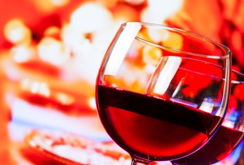 red wine glasses on unfocused restaurant table background