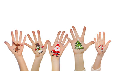 Children's hands raising up with painted Christmas symbols: Sant