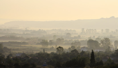 Village in a foggy morning