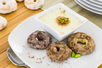 Vanilla pudding whith italian cookies glassed on white dish