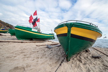 Naklejka na ściany i meble Fishing boats on Baltic Sea beach in Karlikowo, Sopot, Poland