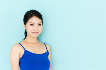 Obraz premium attractive asian woman on blue background
