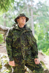 young soldier or ranger in forest