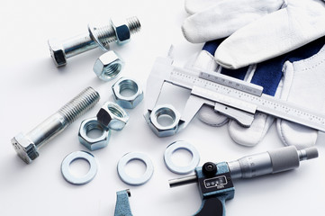 Measurement of steel nuts. Measuring with vernier caliper