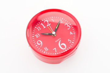 Red clock isolated on white background