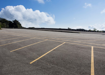 asphalt roadway with cloud blue sky background