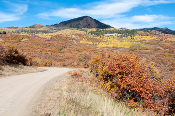 Urban road way to mountain peak, colorado 