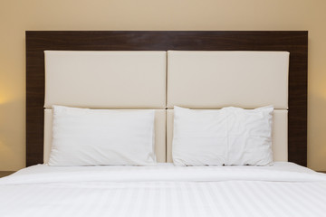 bedroom with headboard leather and wood