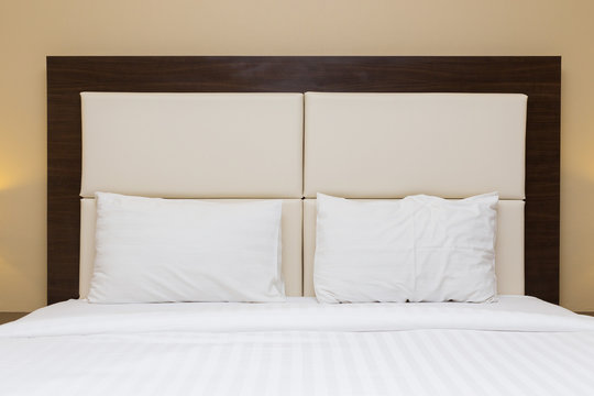 bedroom with headboard leather and wood