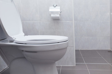 Naklejka na ściany i meble white flush toilet in modern bathroom interior
