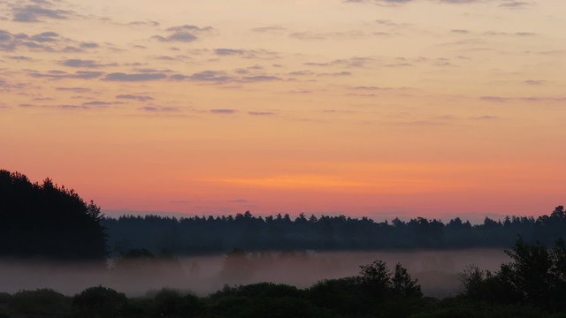 Sunrise on foggy morning