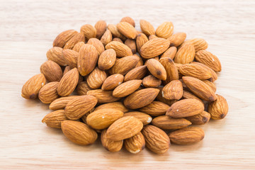 Almond on wooden background