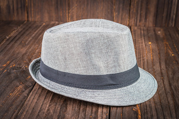 Beach hat on wooden background