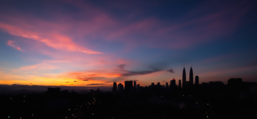 Fototapeta na wymiar Blur image silhouette of Kuala Lumpur city panorama
