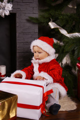Fototapeta na wymiar Little Santa Claus with gifts