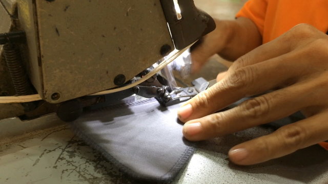 stitching on textile with overlock sewing machine