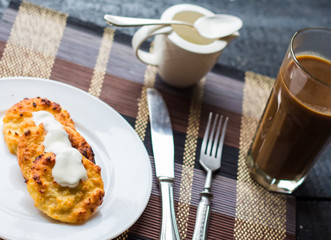 baked cheesecakes with sour cream and coffee with milk, breakfas