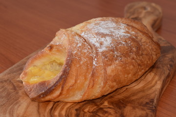 Fresh baked croissant with vanilla filling