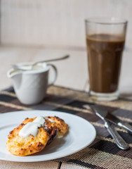 cottage cheese pancakes with sour cream and coffee, breakfast