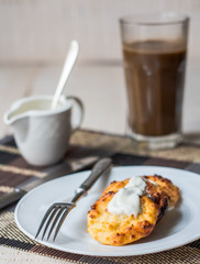 cottage cheese pancakes with sour cream and coffee, breakfast