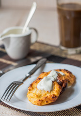 cottage cheese pancakes with sour cream and coffee, breakfast