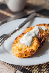 cottage cheese pancakes with sour cream and coffee, breakfast