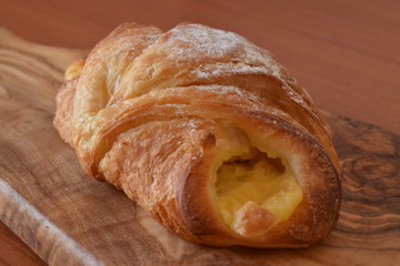 Fresh baked croissant with vanilla filling