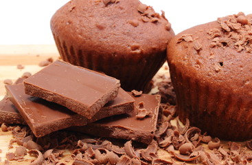 Fresh baked muffins, grated and portion of chocolate