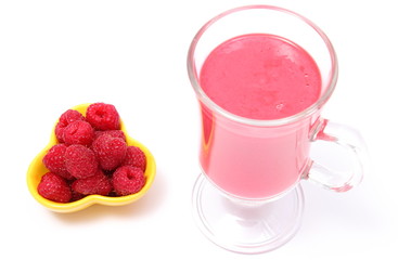 Raspberries in yellow bowl and fresh cocktail