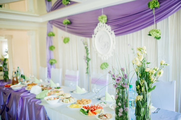 a laid wedding banquet table at a restaurant