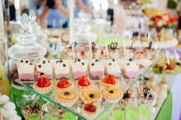 Different cakes on banquet table