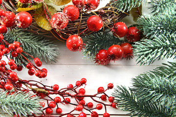 Christmas card with berries, wreath and conifer branch
