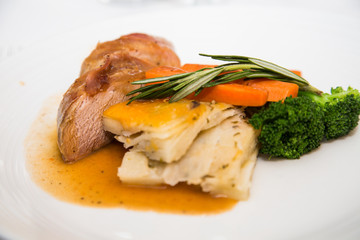 Roast Chicken Dinner with Broccoli garnished with Rosemary