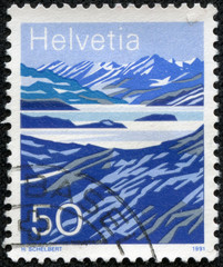 stamp printed in the Switzerland shows Mountain Lakes