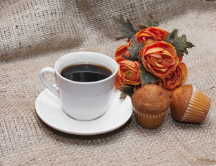 Coffee and muffins with flowers