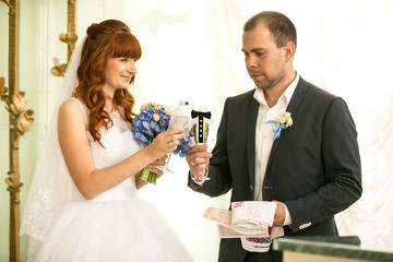 bride and groom holding glasses of champagne