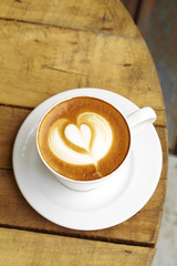 close up hot latte on wooden table