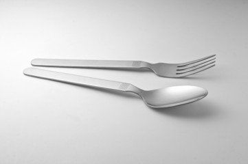 Fork and spoon on white background