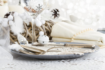 Fototapeta na wymiar Christmas Table Setting with traditional Holiday Decorations