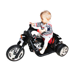 Fototapeta na wymiar road warrior - one year old baby on a motorcycle