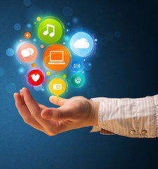 Multimedia icons in the hand of a woman