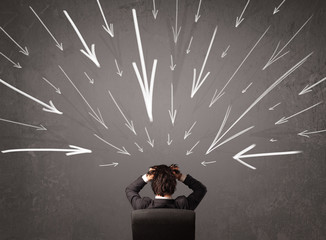 Business man with hand drawn arrows pointing at his head