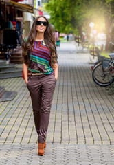 Fashionable woman walking in the street