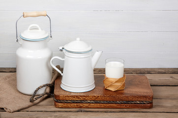 glass of fresh milk old wooden table