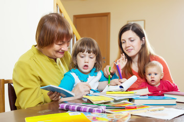 Happy woman with adult daughter and  children