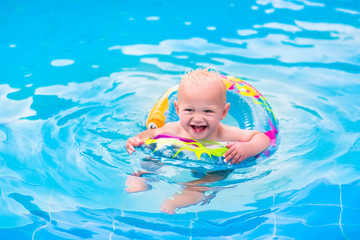 Fototapeta na wymiar Cute little baby in a swimming pool