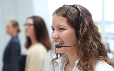 Young employee working with a headset