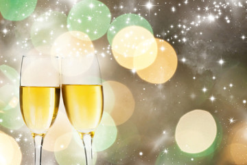 Glasses with champagne against fireworks